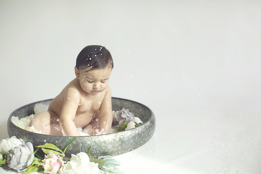 Clovis-Baby-Photographer-Designs-By-Tonya Milkbath baby in metal tub with flowers splashing